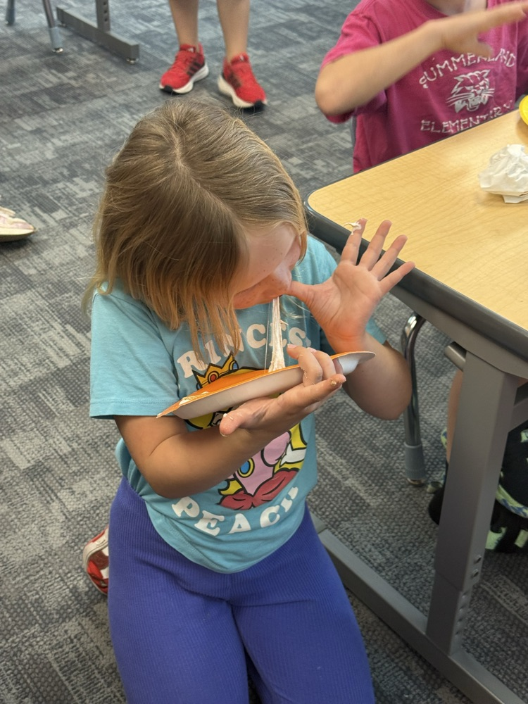student eating a s’more