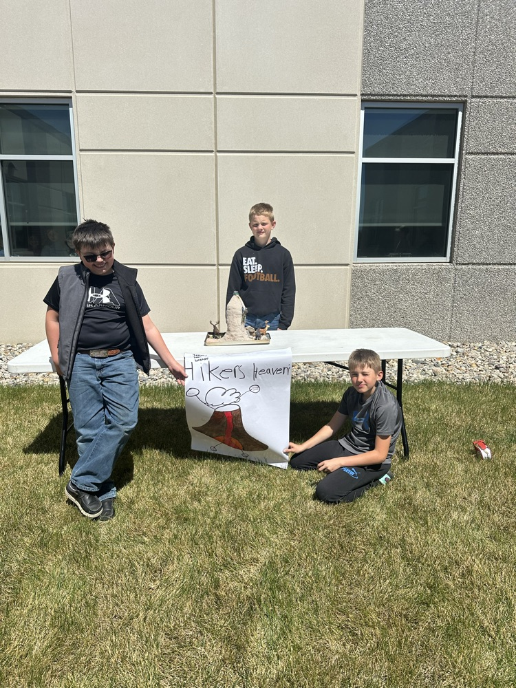 A group of students presenting their volcano. 