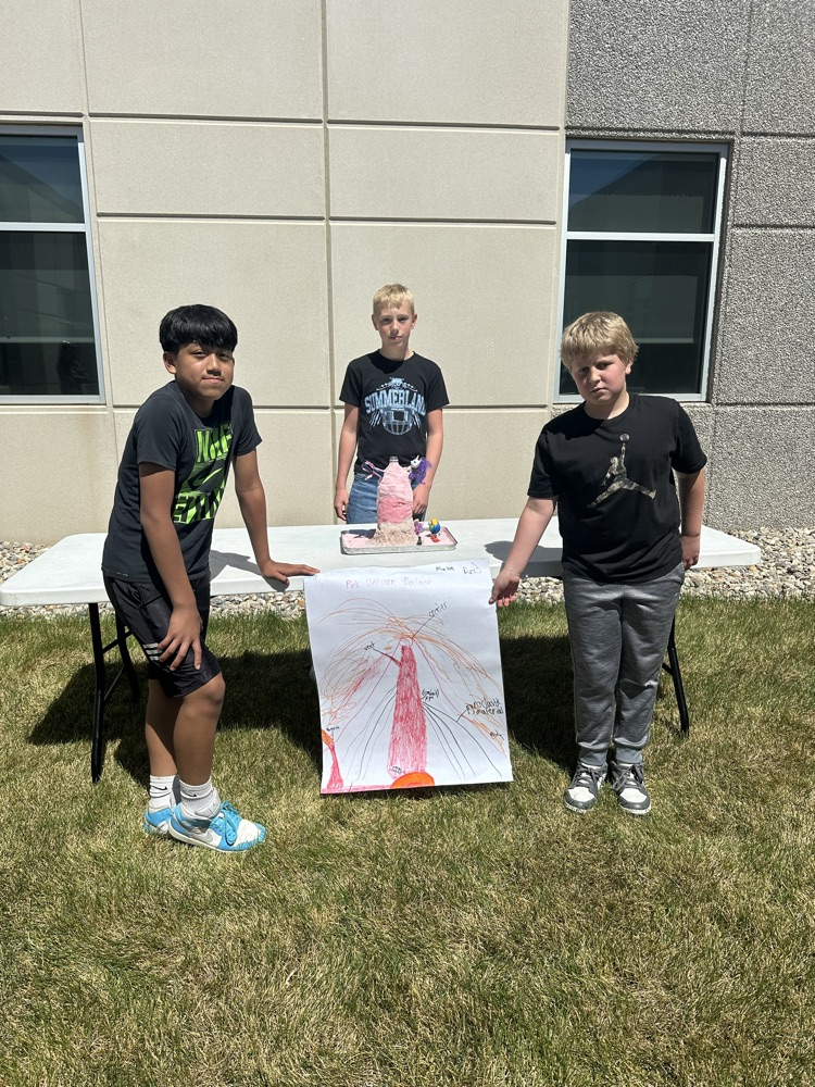 A group of students presenting their volcano. 