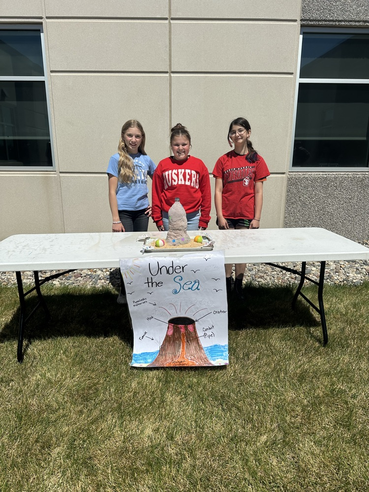 A group of students presenting their volcano. 