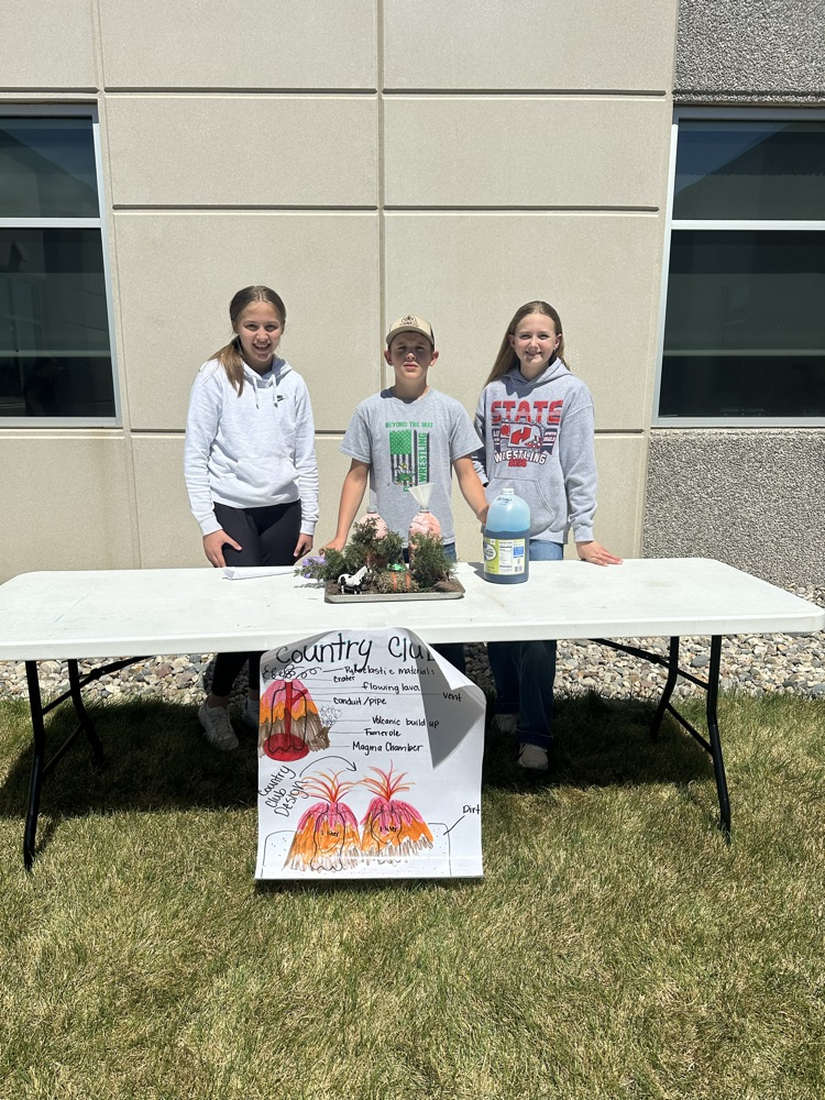 A group of students presenting their volcano. 