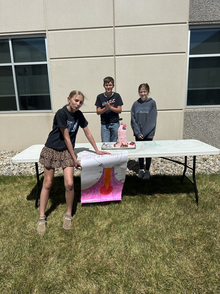 A group of students presenting their volcano. 