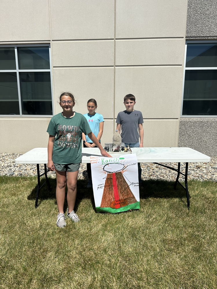 A group of students presenting their volcano. 