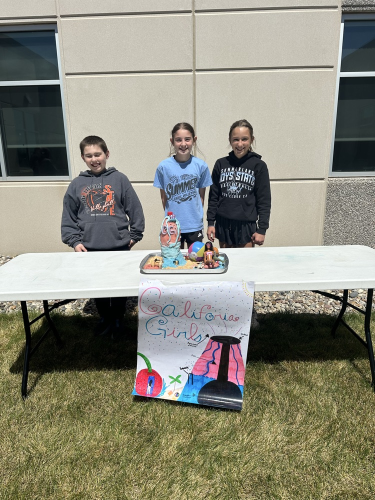 A group of students presenting their volcano. 