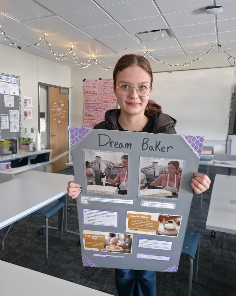 A senior girl in high school holding a self-made poster about owning a bakery. 
