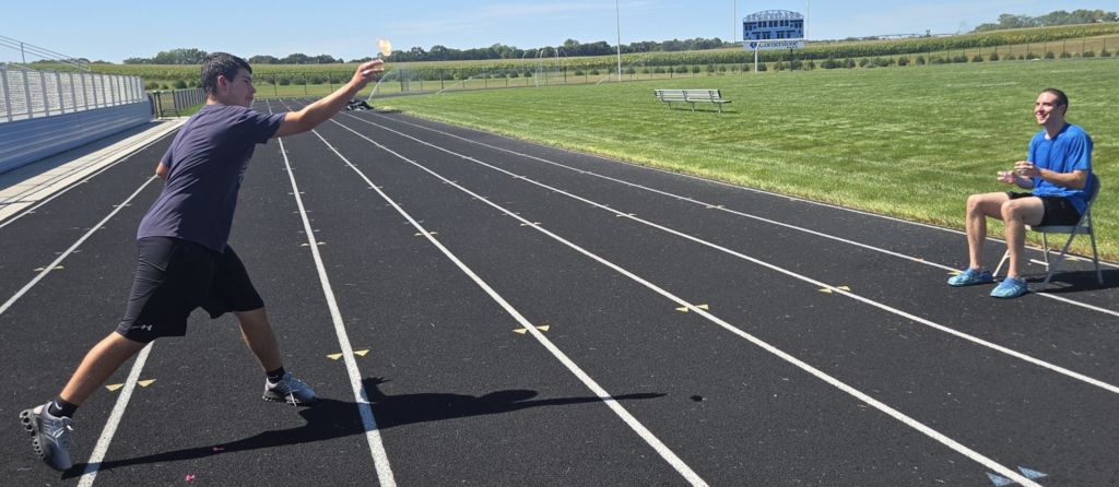 Water balloons being thrown at Mr. Birch