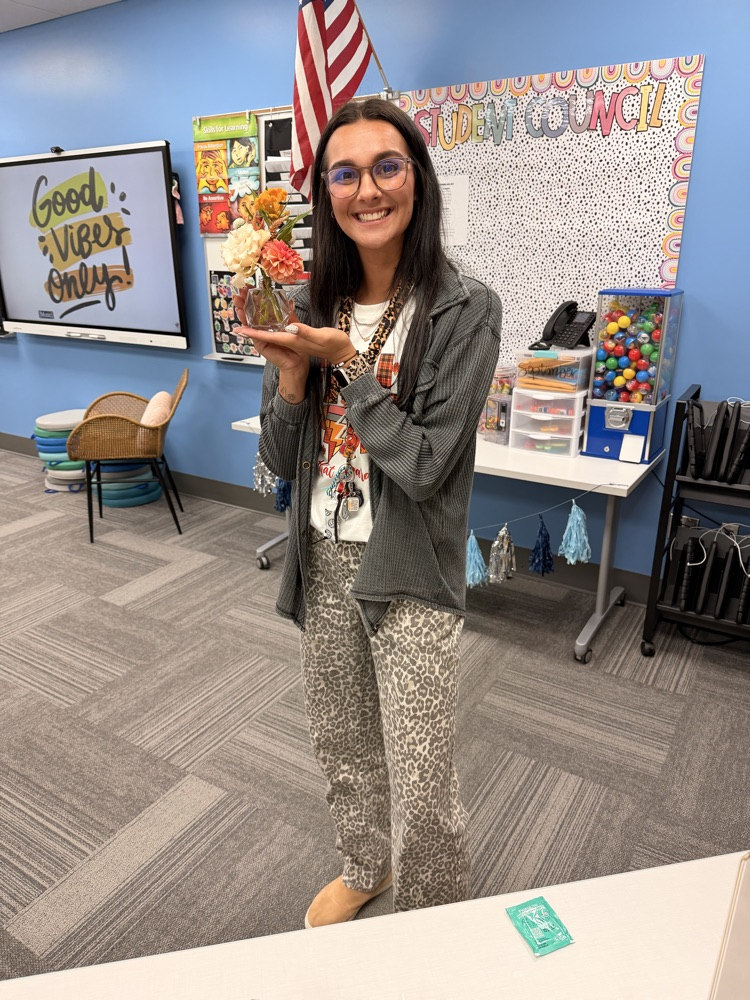 staff holding bouquet created at bloom bar