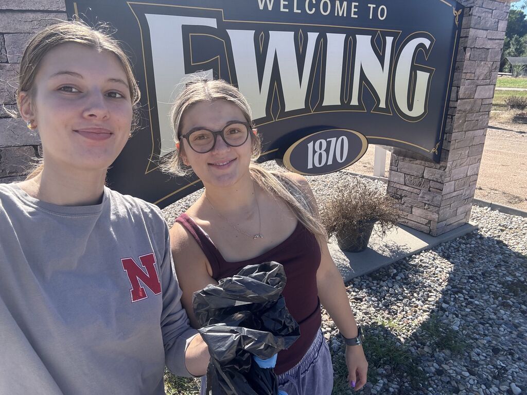 Kaylee and Abryelle picking up garabe in the Ewing, Clearwater and Orchard area as part of the Go Green Ribbon Project for FBLA