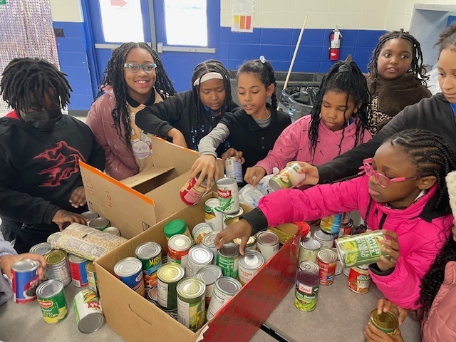 Peer Helpers organizing cans