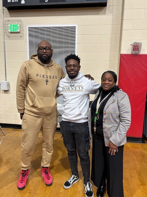 Coach, former student and Mrs. Jones
