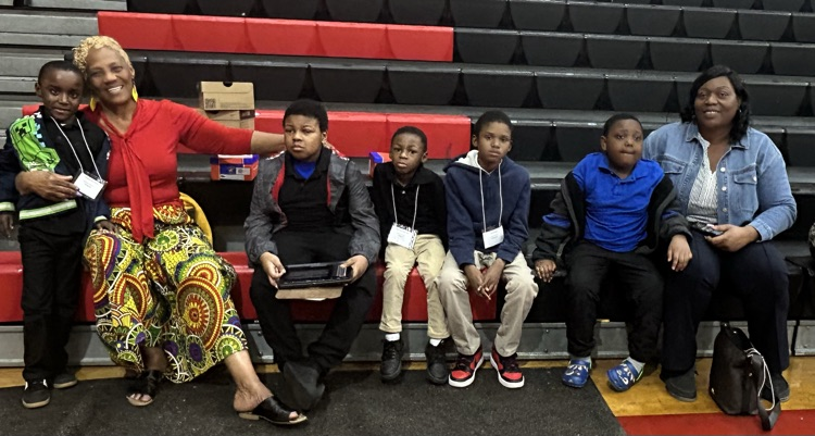 Small group of students from LJHS posing for a picture with their shoes