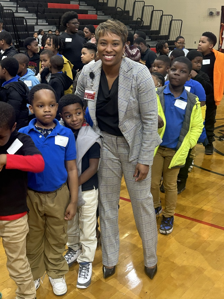 Supt. Burroughs posing with students 