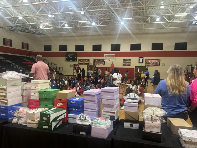 Group picture of YWE Students waiting to get their shoes