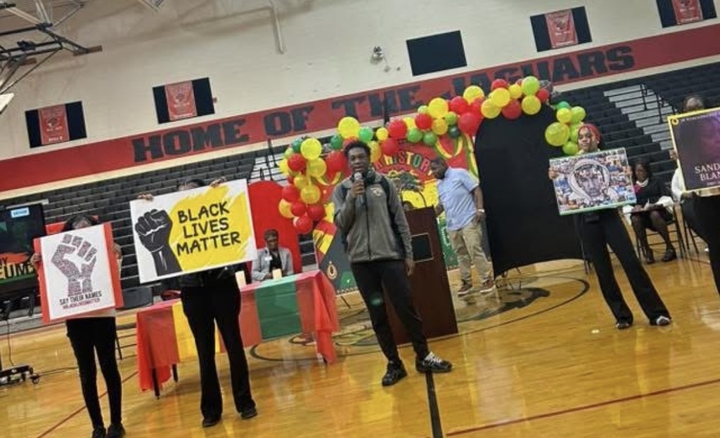 Students presenting in gym at SCHS