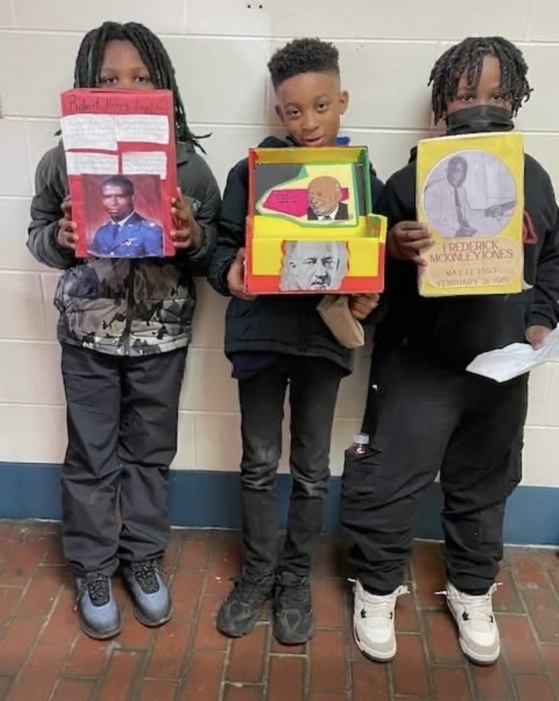 Students presenting in gym at LJHS