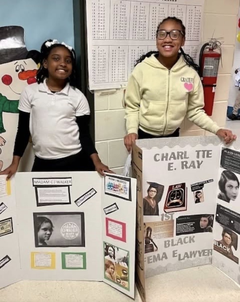 Students presenting in gym at LJHS