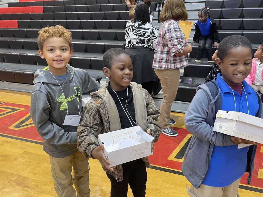 More students receiving shoes.