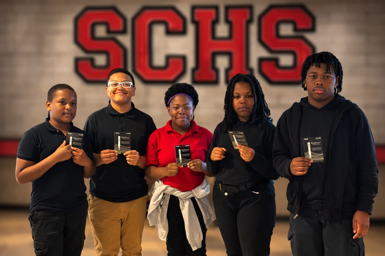 Austin Taylor, Kaicen Jones, Sakyia Pickens, Eriana Young, Jalon Delaine  are holding $100 gift cards they earned for perfect attendance 3rd nine weeks