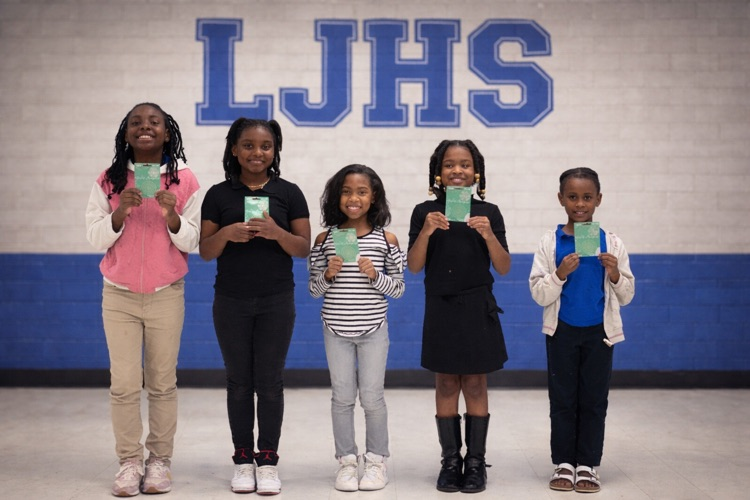 Students holding $100 gift cards after having perfect attendance 3rd nine weeks. The students are Natalie Coleman, Kenley Wade, Jada Coats, Layla Coats, Skylar James