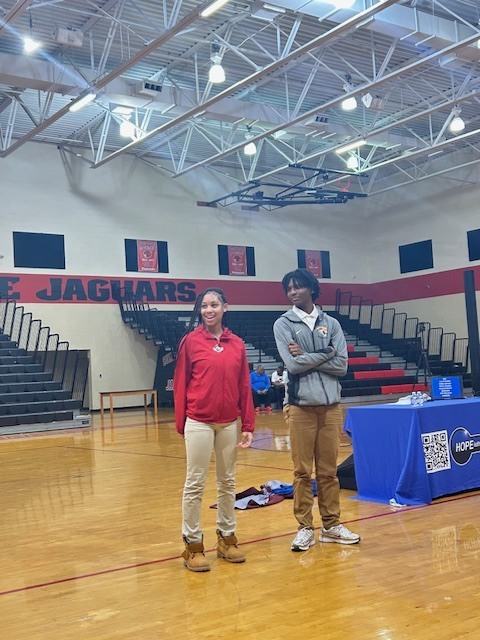 two high school students as volunteers