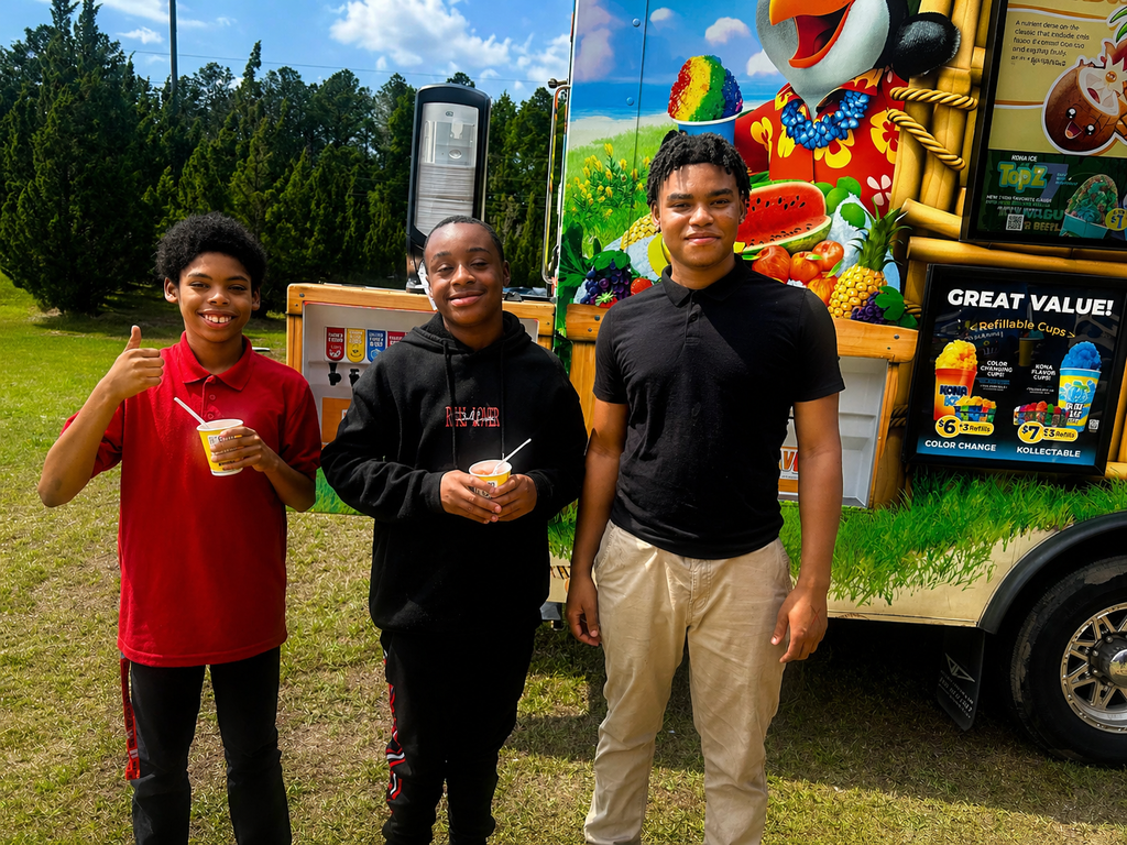students in front of snow cone truck
