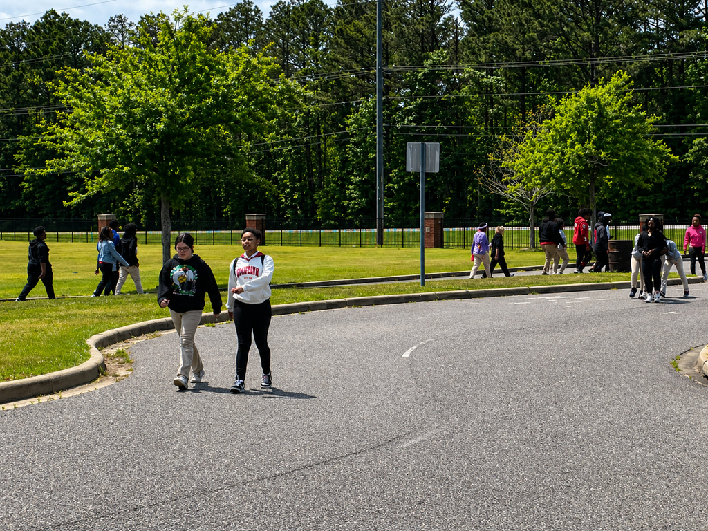Teen stroll through campus park