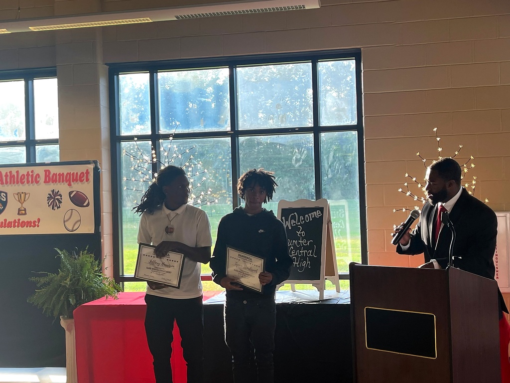 A series of photos from the Sumter Central High School Athletic Banquet held on May 4. Student-athletes stand in groups inside a decorated banquet hall while receiving awards, medals, plaques, and certificates for their athletic achievements. Coaches and presenters speak from a podium as students pose for recognition photos. Decorations include red and black table coverings, sports-themed displays, footballs, banners reading “Sumter Central Athletic Banquet,” and lighted decorative trees. The event celebrates student-athletes from multiple sports programs at Sumter Central High School.