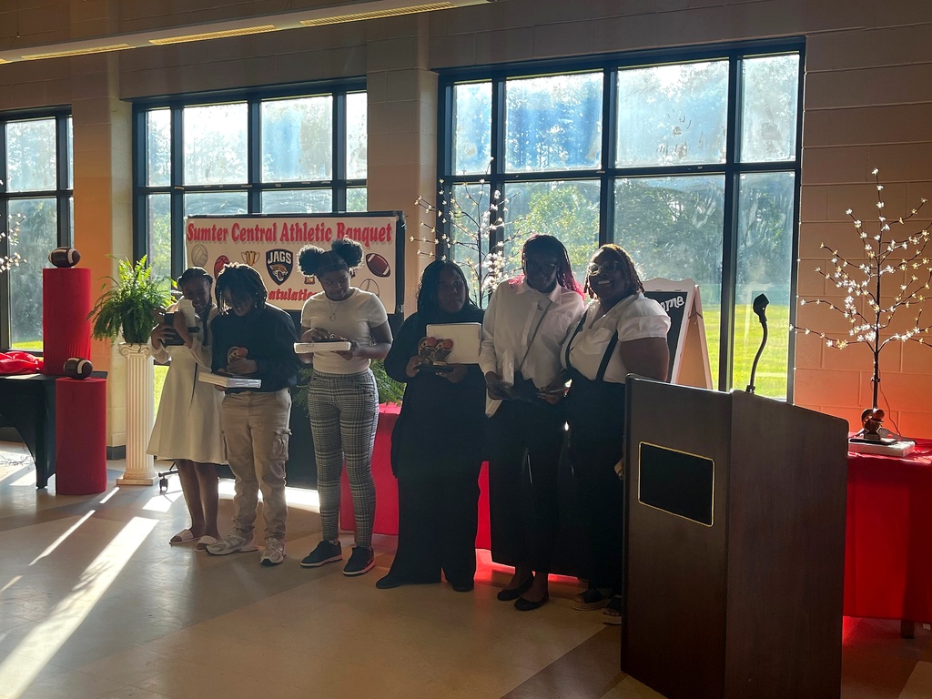 A series of photos from the Sumter Central High School Athletic Banquet held on May 4. Student-athletes stand in groups inside a decorated banquet hall while receiving awards, medals, plaques, and certificates for their athletic achievements. Coaches and presenters speak from a podium as students pose for recognition photos. Decorations include red and black table coverings, sports-themed displays, footballs, banners reading “Sumter Central Athletic Banquet,” and lighted decorative trees. The event celebrates student-athletes from multiple sports programs at Sumter Central High School.