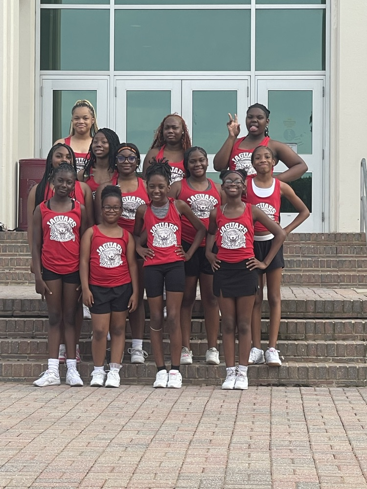 cheerleaders posing on the steps