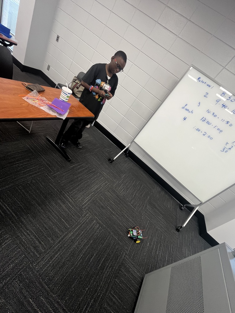 student playing with robot