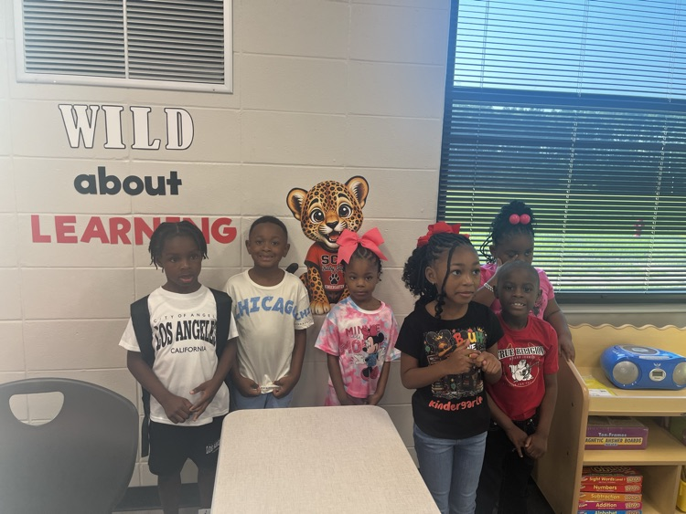 students posing in class