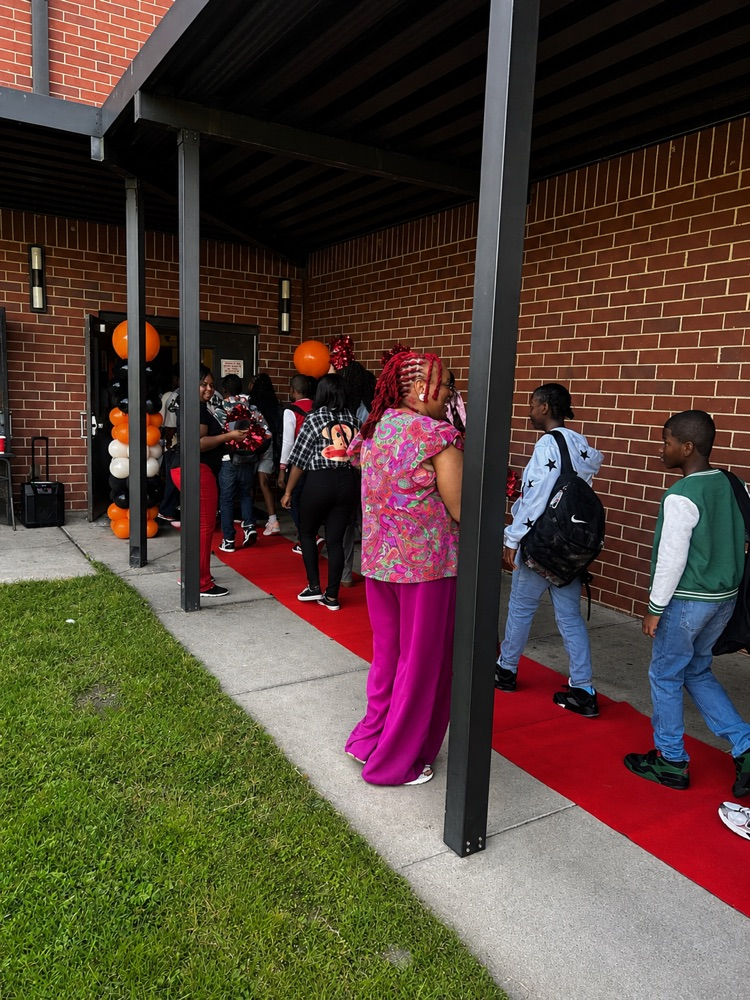 students walking the red carpet
