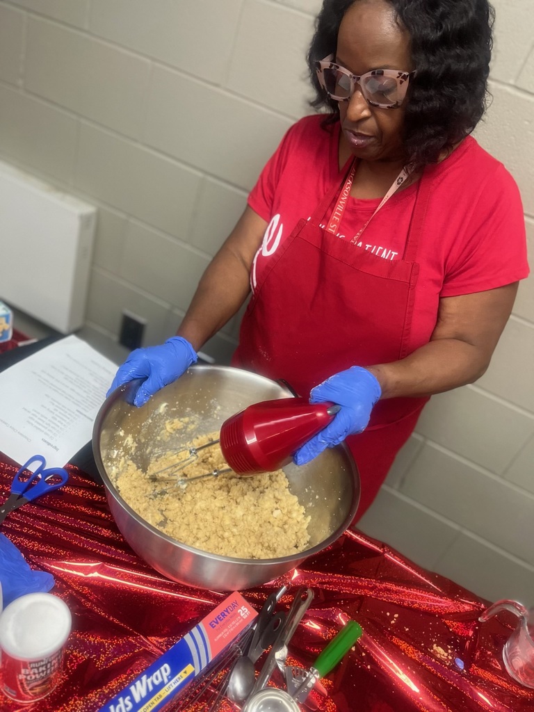 teacher mixing baking ingredients