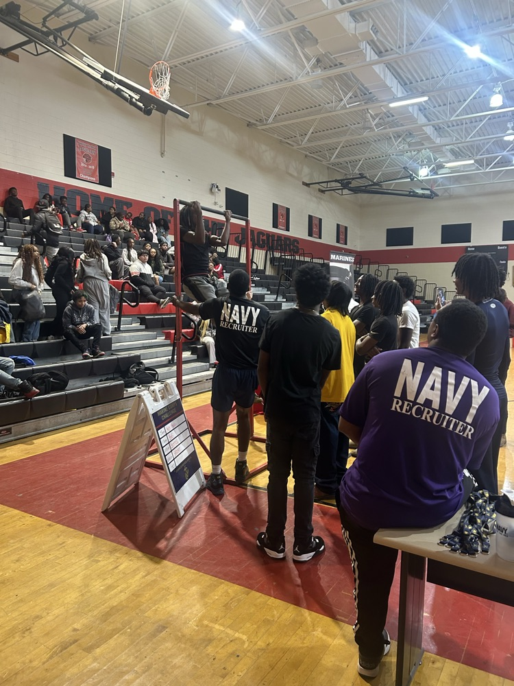 Students talking with military recruiter