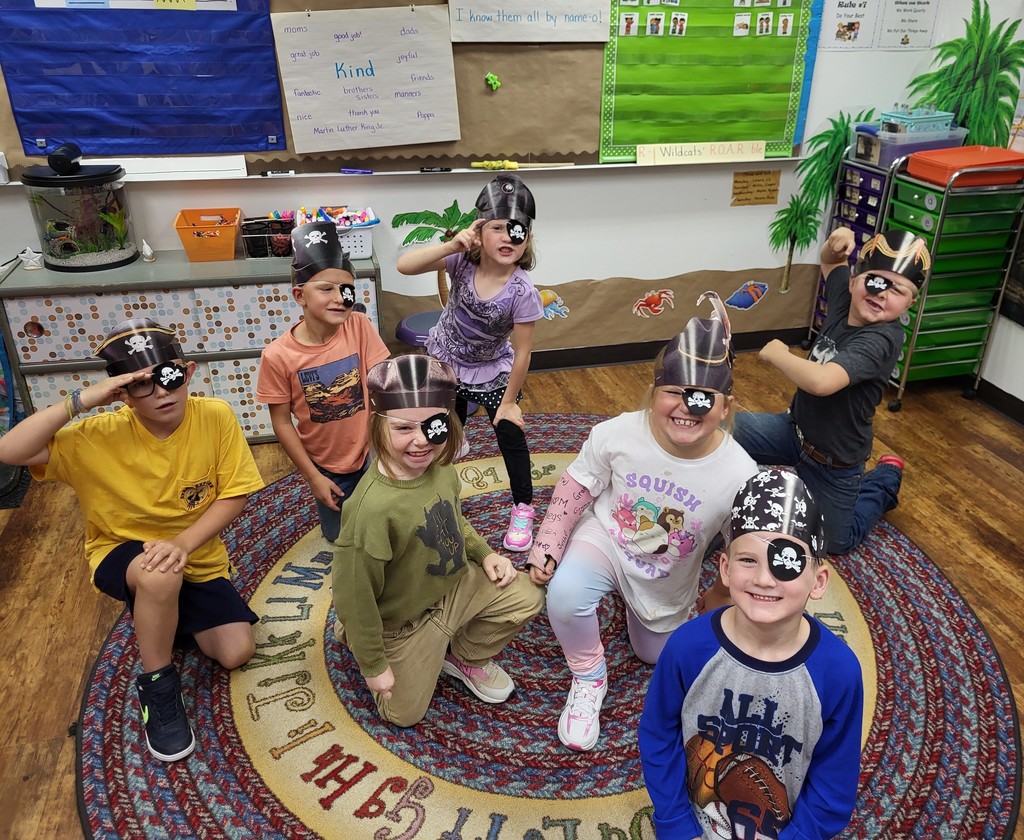 kids on a rug in pirate gear