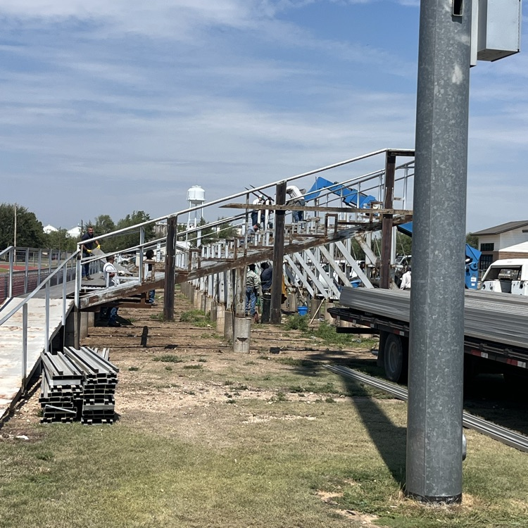 visitor bleacher being taken down
