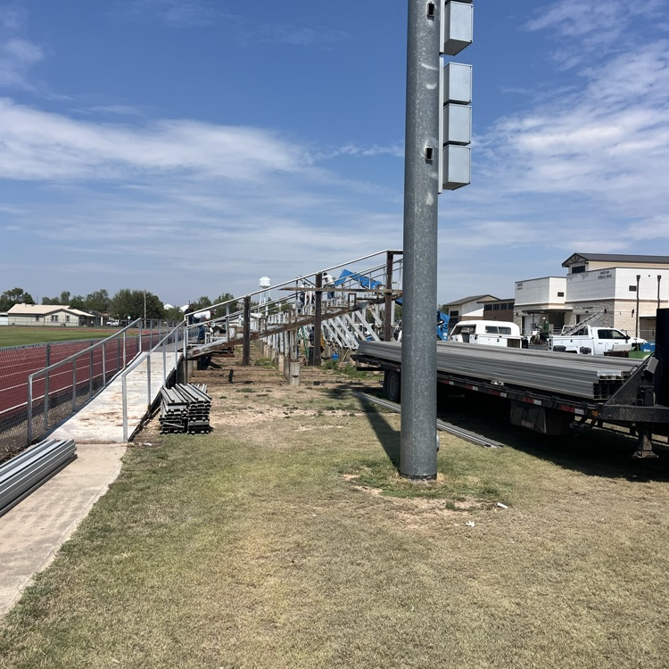 visitor bleacher being taken down