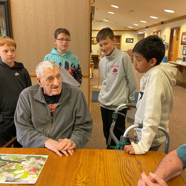 5th graders hearing stories about the residents 