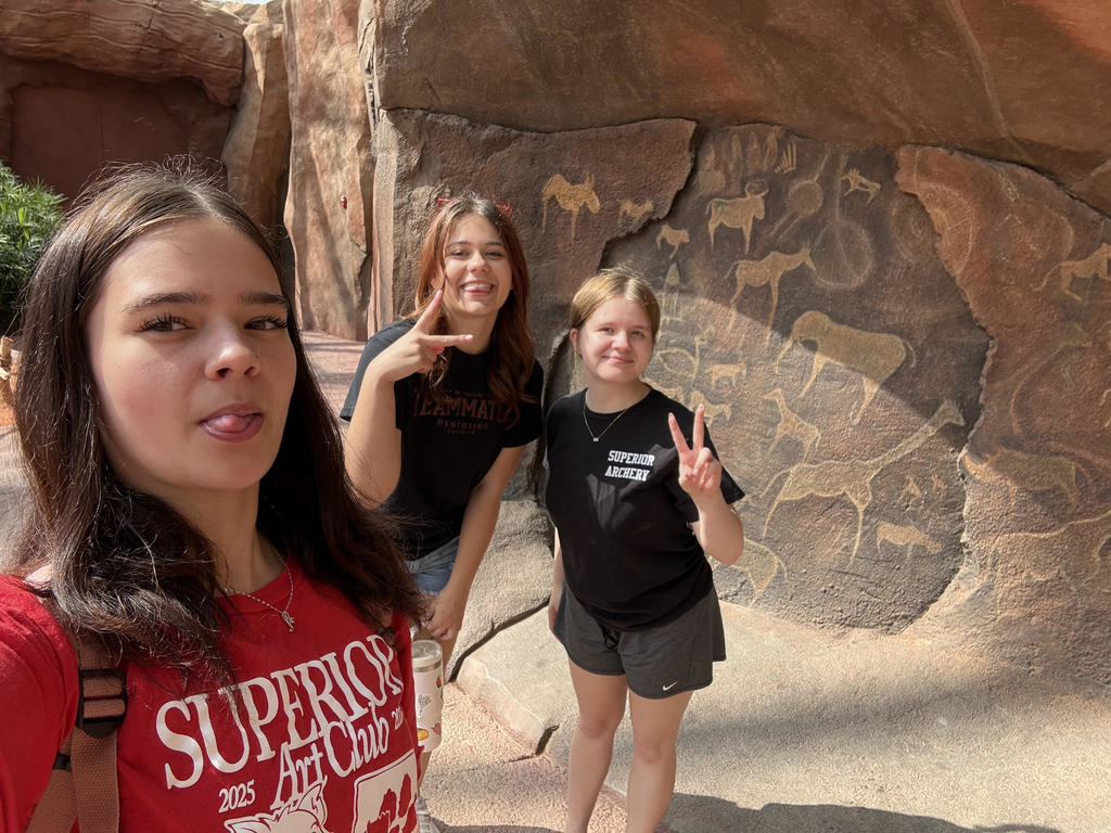 Art Club members with wall paintings