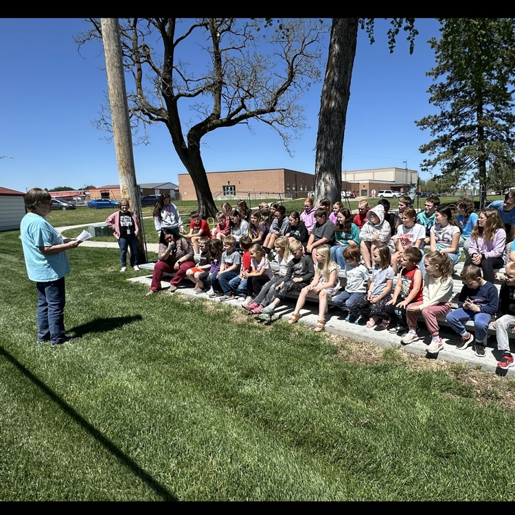 Students attending the Arbor Day observance ceremony .