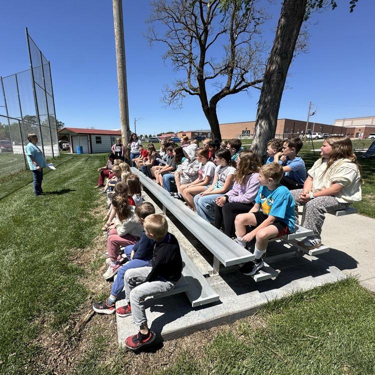 Students attending the tree planting ceremony .