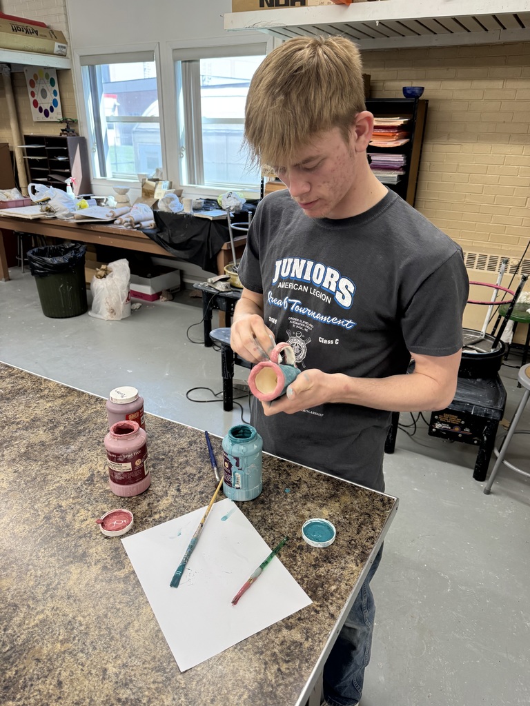 Student working on his glazing