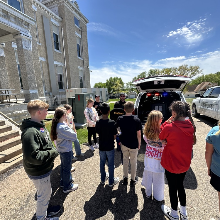 Students learning about the items officers use for protection 