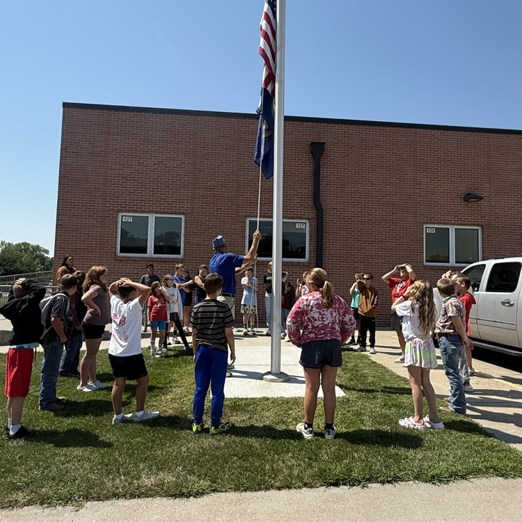 5th graders learn how to raise and lower the flag to half staff. 