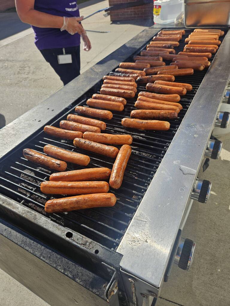 hot dogs on the grill