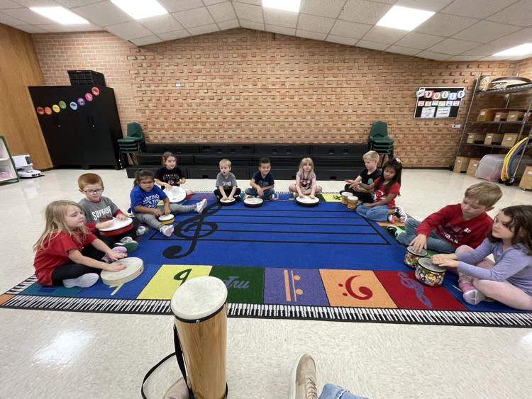 KB practicing the “bunny” character of the story on their hand drums and bongos.