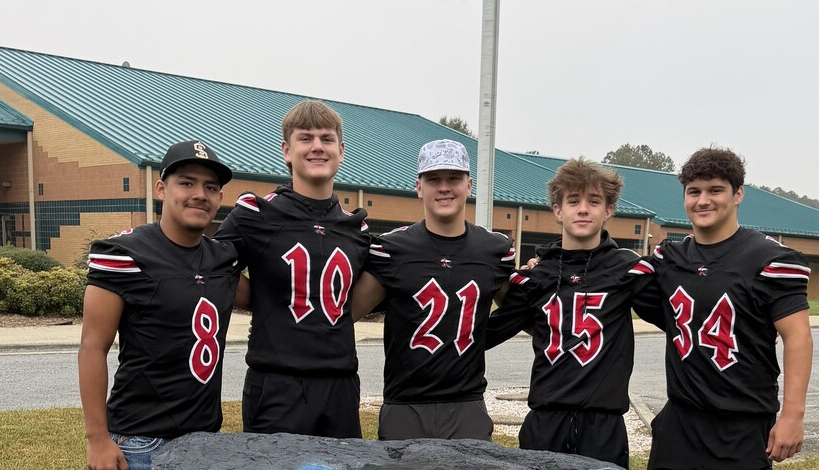 East Surry Football players visit Shoals Elementary