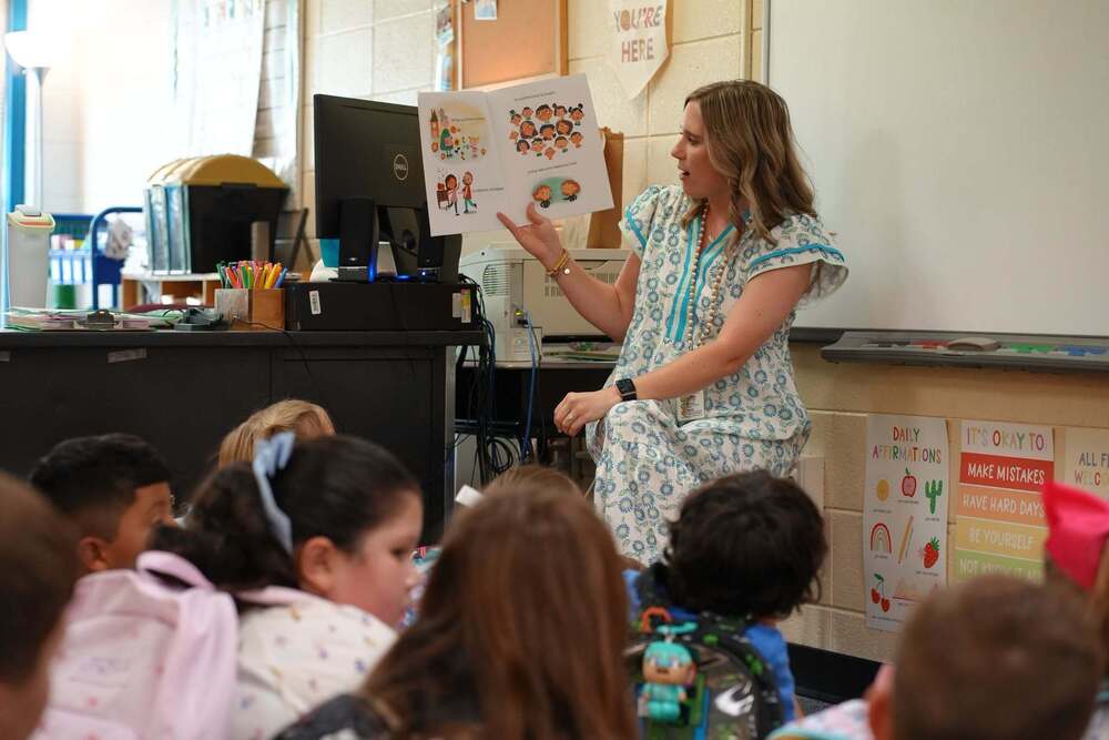 Teacher reads book to class