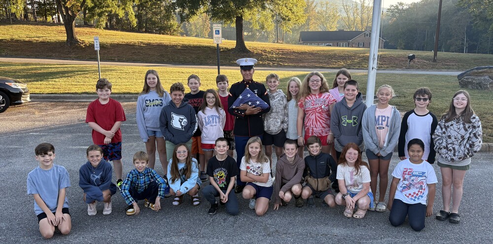 Private First Class Youngblood teaches 5th grade how to properly fold the flag!
