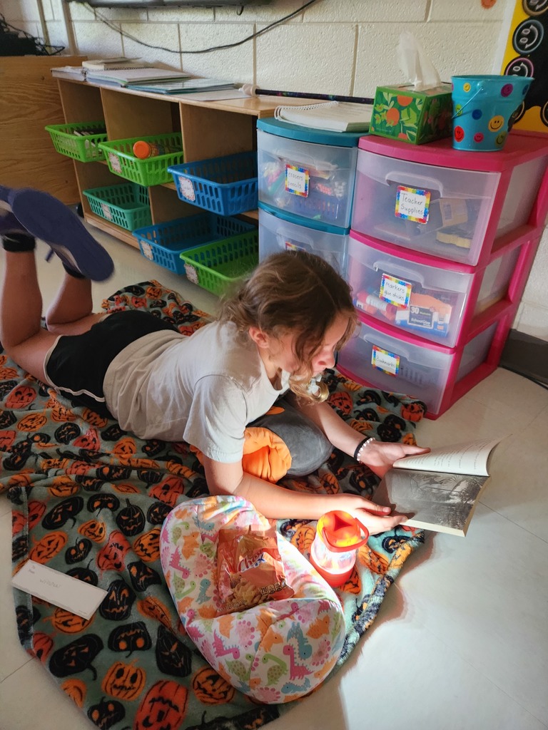 student reading by flashlight